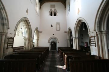 Nave looking west to the tower, with interesting Saxon openings.