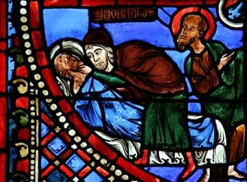 Simon Magus tries to raise the senator Nicostratus from the dead, but is only able to move his head a little. Behind him, St. Paul gestures to Peter's subsequent success at the same task. Detail of Peter and Paul Window in the ambulatory of Bourges Cathedral, dating from c.1215-25.