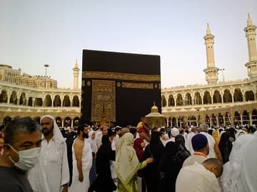 Pilgrims walk around the Ka'ba just after dawn during the month of Ramadan.