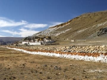 Guru Rinpoche Monastery with long mani wall.