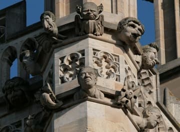 Amusing modern sculptures on the medieval bell tower (1492-1505).