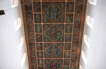 The painted wooden ceiling of the nave is a rare and beautiful survival, dating from 1230. It survives thanks to its removal in 1943 before wartime bombing destroyed much of the church. Comprised of 1,300 oak boards covering an area 27.8m long by 8.7m wide, it depicts the Tree of Jesse (the family tree of Christ). Also pictured are 42 medallions of the ancestors of Christ, Adam and Eve, the Four Evangelists, and the Rivers of Paradise. The area showing Christ enthroned is the only part that is not original - that section of the ceiling collapsed in 1650 and was remade in 1960.