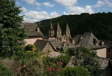 A glimpse of the Church of St. Foy's towers over the rooftops of the village of Conques.