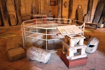 Octagonal tank for baptism, in the center of the interior.