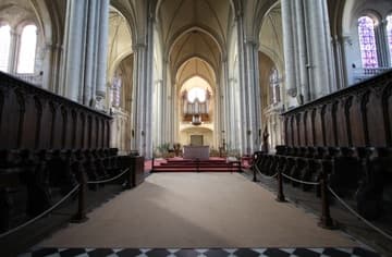 The 13th-century choir of Poitiers Cathedral, looking west. The choir stalls date from about 1250 and are carved with a variety of interesting figures.