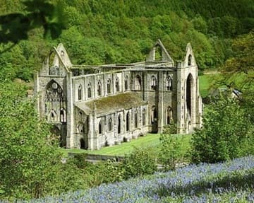 View of the abbey church from the hill above. Postcard photo