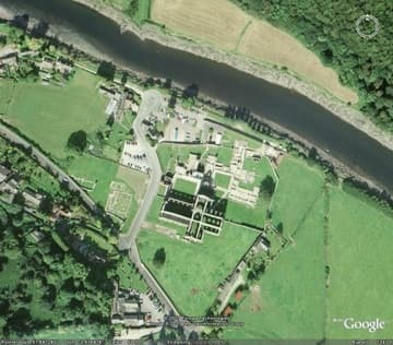 Aerial view of Tintern Abbey from an eye-altitude of 1,393 feet. Like all Cistercian monasteries, Tintern was built "far from the concourse of man" and along a river.