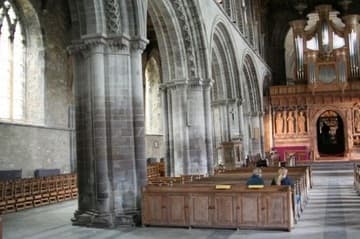 Left (north) side of the nave of St. David's Cathedral, with outward-leaning pillars.