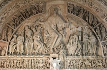 Central tympanum in the narthex, depicting Pentecost or the Mission of the Apostles. In the center is Christ, inside a mandorla (almond-shaped halo). Bolts of light shoot out from Christ's hands to the apostles' heads. The inner archivolt and the lintel below are populated with the peoples of the world who will hear the message of Christ. These include, on the lintel, the "Monstrous Races" of foreign lands. This provides a fascinating insight into medieval worldviews and popular legends.