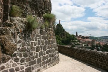 Path around the south exterior of the chapel, with a view of the city of Le Puy. The cathedral can be seen on the right.