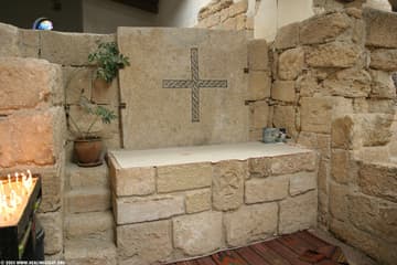 A mosaic cross from the original 4th-century church incorporated into a lovely modern altar.