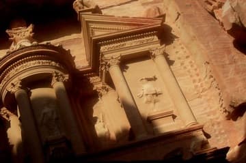 Upper facade of the Treasury, in shadows.