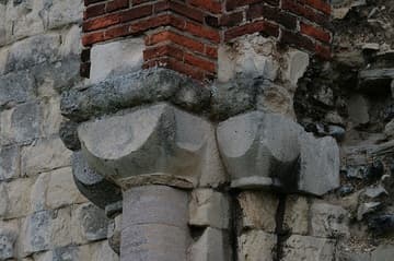 Detail of Norman (Romanesque) capitals and masonry in the north nave wall.