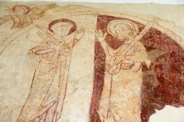 A yin-and-yang roundel with portraits of St Peter and St Paul. These two saints, who share a feast day on June 29, are often shown together as founders of the church, representing the Jewish element in Peter, and the Gentile in Paul. Late 13th-century wall painting in the nave of Black Bourton Church, Oxfordshire, England.