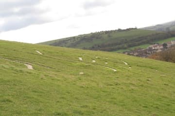 The Giant's club and ribs from the footpath with Cerne Abbas village.
