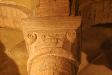 Saxon-style carving of a mermaid in the Norman Chapel.