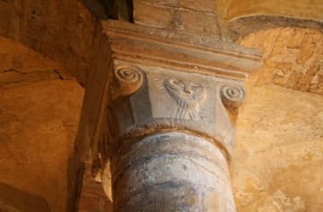 Carved capital of a man's face in the Norman Chapel.