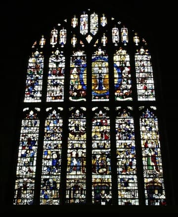About a third of the Great East Window is original (late 15th century) and much of it is a jumble of restored fragments, but the Crucifixion and apostles are clearly recognizable.