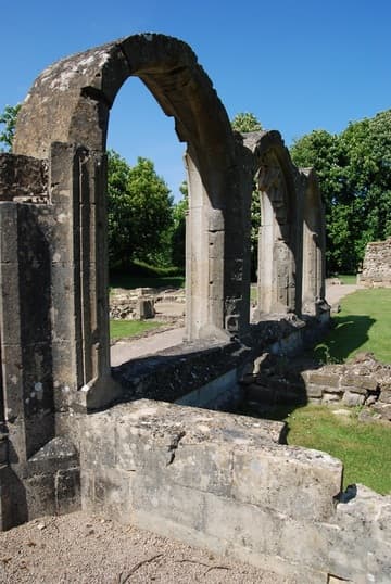 Three surviving arches on the west side of the cloister.