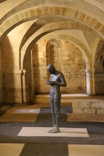 The crypt, with modern sculpture by Anthony Gormley.