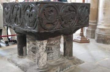 Carved font.