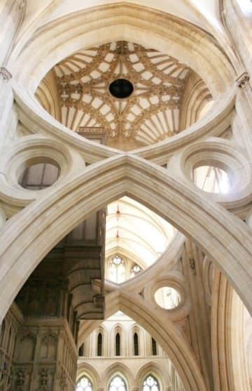 View from the south transept of the unique scissor arches of Wells Cathedral, added in 1338-48 to support the tower when the foundations began to sink. Wells, Somerset, England.