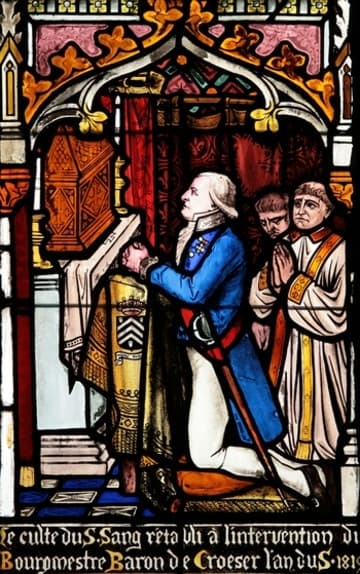 19th-century stained glass: the mayor's prayer before the reliquary.