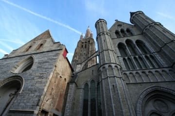 West front and towers, overlooking a narrow street.