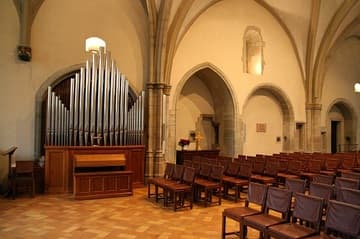 View across the nave, with old organ.