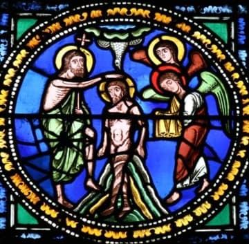 Stained glass depicting the Baptism of Christ.