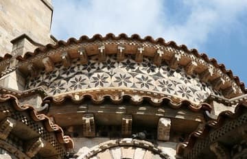 Inlaid stone decoration on the apse, 12th century. Notre-Dame-du-Port, Clermont-Ferrand, Auvergne, France.