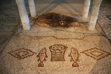 Mosaic and sacred stone under the altar.