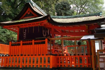 A Shinto priest performs a ritual at the shrine.