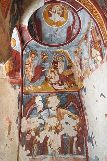 Wall of frescoes in the Apple Church.
