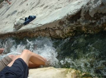 Relaxing tired feet in Pamukkale's hot springs.