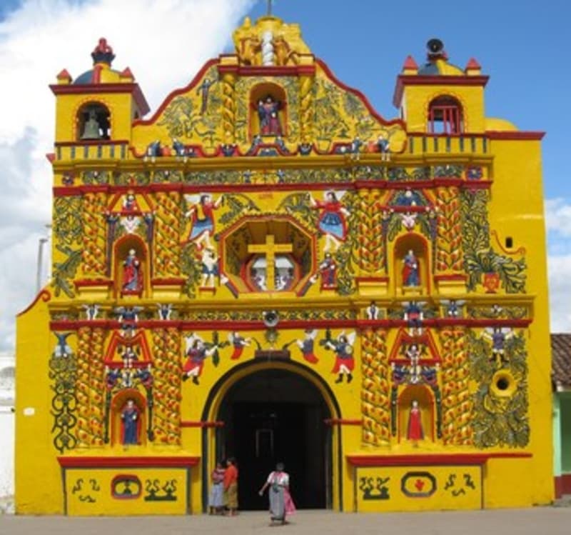 The famous yellow west facade of San Andres Xecul Catholic Church.