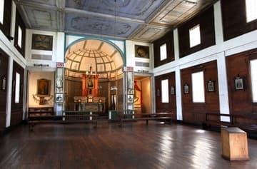 Interior of the mission church, looking south to the altar. The Sacred Heart Mission near Coeur d'Alene was built 1850-53 by Jesuit missionaries and Native Americans. It is the oldest building in Idaho. Today it is owned by the Coeur d'Alene tribe and operated by the state as Old Mission State Park.