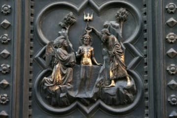 Panel depicting the Baptism of Christ on the south door.