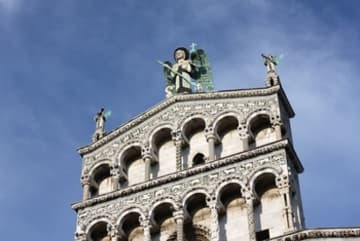 Romanesque statue of Saint Michael atop the west facade.