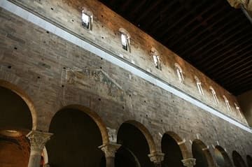Nave wall with 13th-century fresco.