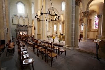 Interior view of the transept, looking north, 12th century. The three arches on the wall represent the Trinity. Saint-Nectaire Church, Auvergne, France.