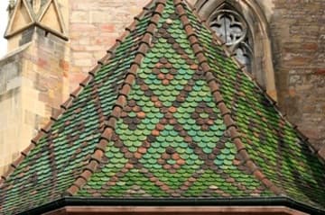 Tiled roof over a side chapel.