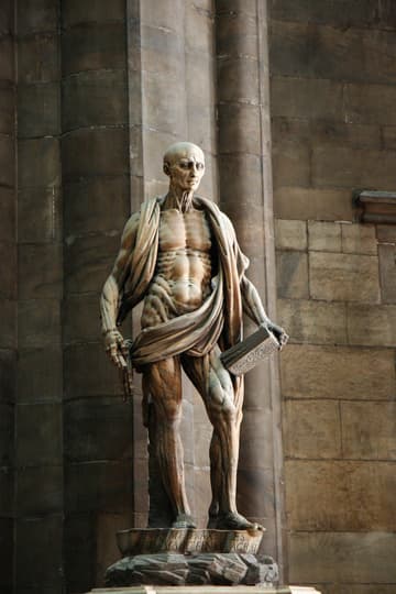 16th-century statue of St. Bartholomew with his skin thrown over his shoulder like a cloak. (According to tradition, he was martyred by being flayed alive.)
