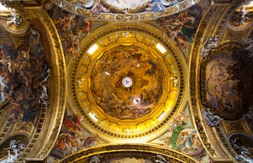 Dome over the crossing with frescoes by  Baciccia. Il Gesu, the mother church of the Jesuits, 16th century. Rome, Italy.