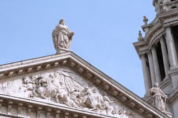 Detail of pediment and statue of St. Paul on the west facade of St Paul's Cathedral, 1675-1708, London, England.