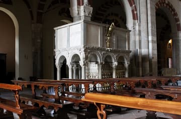 South and west sides of the marble ambo, made in the early 12th century (some sources say 1110, others 1143) and reconstructed after the roof collapsed in 1196. The inner base is an Early Christian sarcophagus dating from 385. Sant'Ambrogio Basilica, Milan, Italy.
