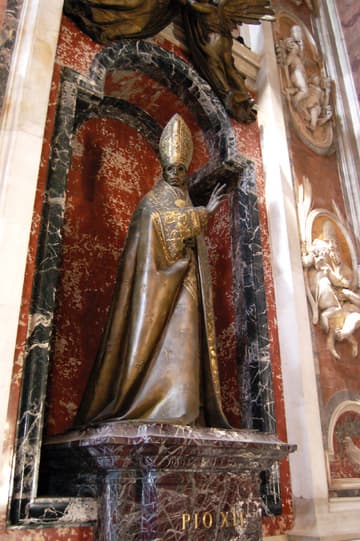 Monument to Pope Pius XII (1939-58), who reigned during World War II. Before the war broke out he famously said, "Nothing is lost with peace; everything can be lost with war." The monument is by Francesco Messini (1964).