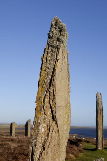 Detail of stone 9, on the east side of the circle, viewed from southeast. Ring of Brodgar, c. 2500 BC, Mainland, Orkney Islands, Scotland. Measuring nearly 104 m in diameter, this impressive Neolithic monument is a true circle that is thought to have originally consisted of 60 stones. Today 27 stones remain standing, ranging in height from 2.1 m to 4.7 m. The ring is positioned on a scenic strip of land between the freshwater Loch of Harray (to NE) and the saltwater Loch of Stenness (to SW).