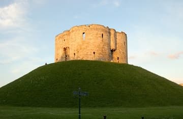 The fortress now known as Clifford's Tower in York was originally built by William the Conquerer in 1068, as part of his campaign to subdue the North under Norman rule. A century later it became the site of terrible anti-Jewish violence in which many lost their lives. York, England.