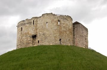 The fortress now known as Clifford's Tower in York was originally built by William the Conquerer in 1068, as part of his campaign to subdue the North under Norman rule. A century later it became the site of terrible anti-Jewish violence in which many lost their lives. York, England.